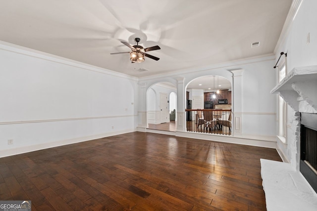 unfurnished living room featuring ornamental molding, dark hardwood / wood-style floors, and ceiling fan