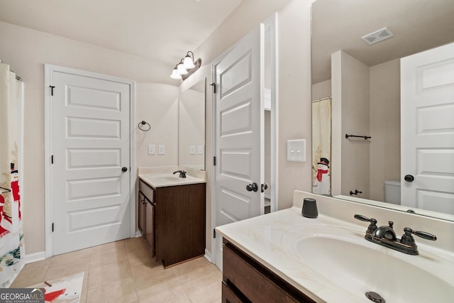 bathroom with vanity and tile patterned floors