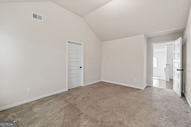 interior space with lofted ceiling and carpet