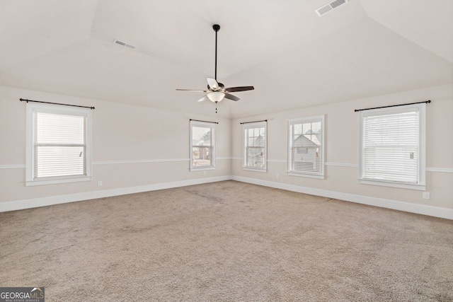 unfurnished room featuring ceiling fan, lofted ceiling, and carpet floors