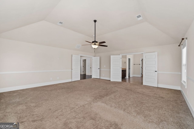 unfurnished bedroom with lofted ceiling, carpet flooring, and ceiling fan