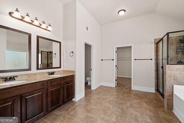 full bathroom with vanity, vaulted ceiling, plus walk in shower, and toilet