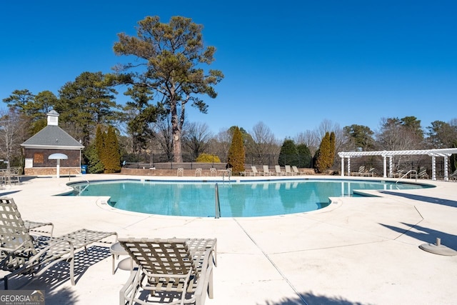 view of swimming pool featuring a pergola and a patio area