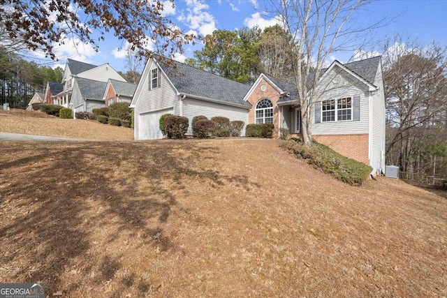 front of property featuring a garage and a front yard