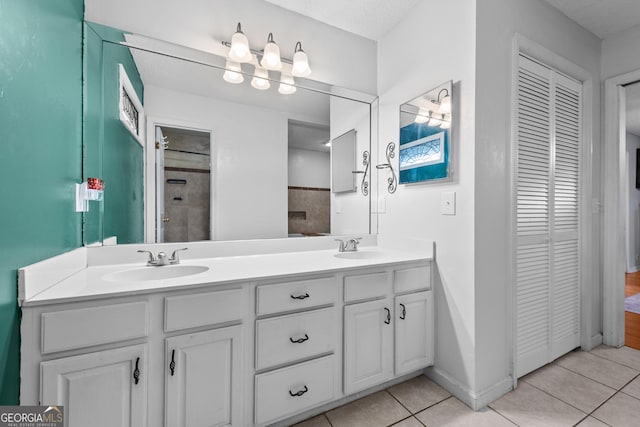 bathroom with vanity and tile patterned flooring