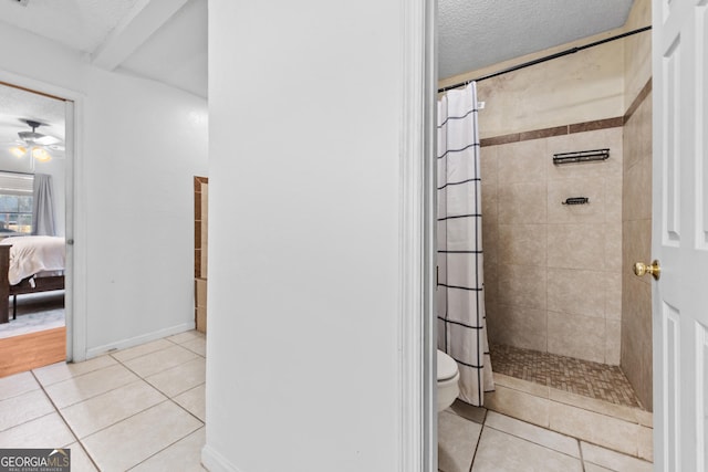 bathroom featuring tile patterned flooring, a textured ceiling, and a shower with shower curtain