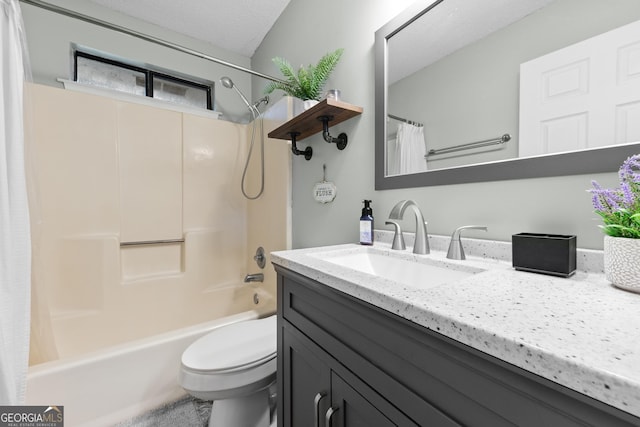 full bathroom with vanity, shower / tub combo with curtain, a textured ceiling, and toilet