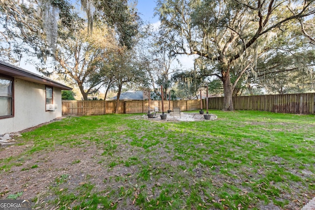 view of yard with an outdoor fire pit