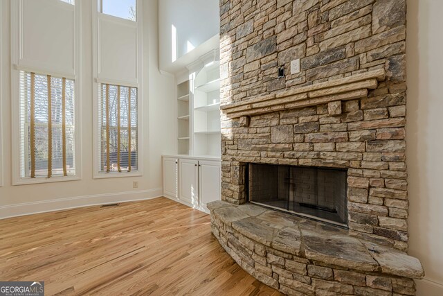 unfurnished room featuring crown molding, ceiling fan, and light hardwood / wood-style floors