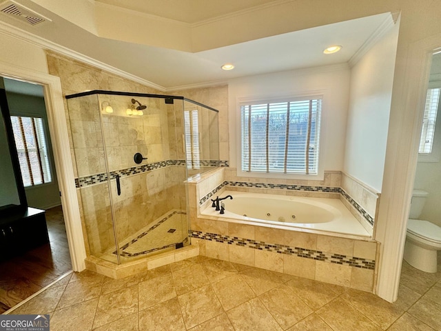 bathroom featuring ornamental molding, toilet, separate shower and tub, and plenty of natural light