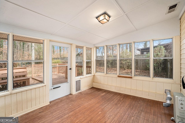 unfurnished sunroom with lofted ceiling and plenty of natural light