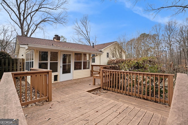 deck with a sunroom