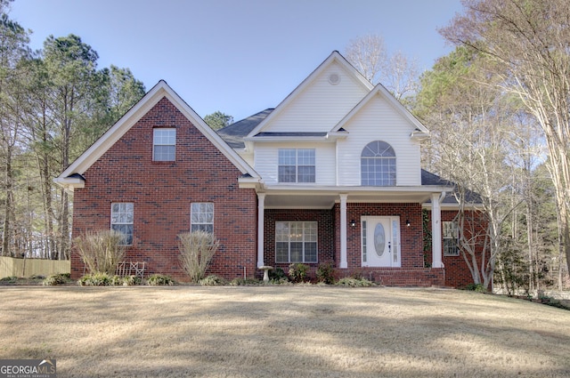 front facade featuring a front lawn and a porch