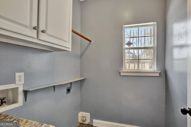 laundry room featuring cabinets, hookup for a washing machine, and hookup for an electric dryer