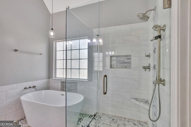 bathroom featuring independent shower and bath and tile walls