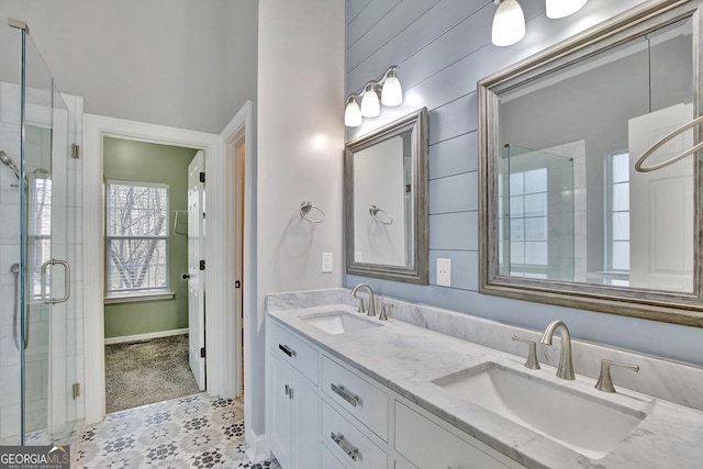 bathroom with walk in shower and vanity