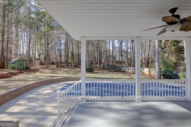 view of patio featuring a pool side deck and ceiling fan