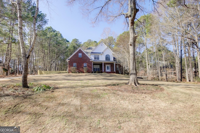 front facade with a front yard