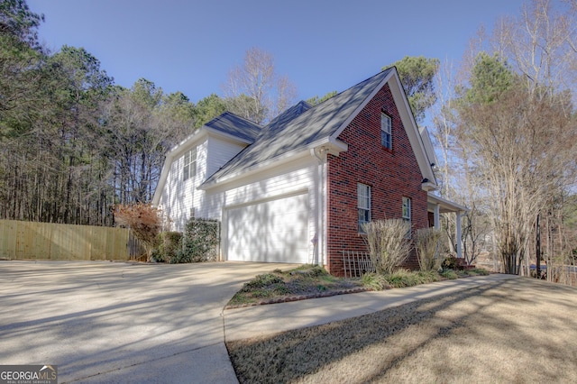 view of side of property with a garage