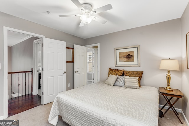 carpeted bedroom with ceiling fan