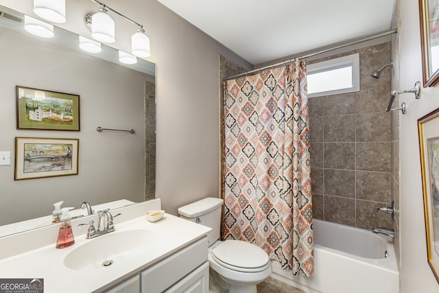 full bathroom with shower / bathtub combination with curtain, vanity, and toilet