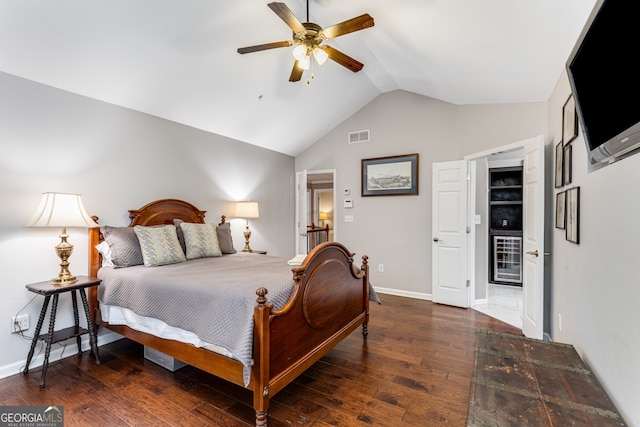 bedroom with dark hardwood / wood-style flooring, lofted ceiling, and ceiling fan