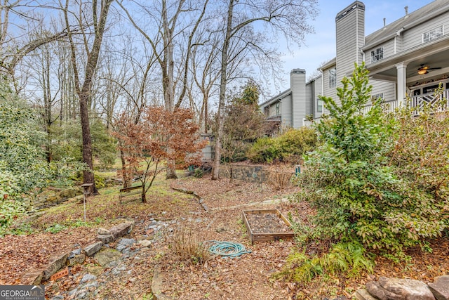 view of yard featuring ceiling fan