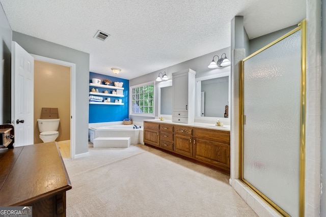 full bathroom featuring vanity, shower with separate bathtub, and a textured ceiling