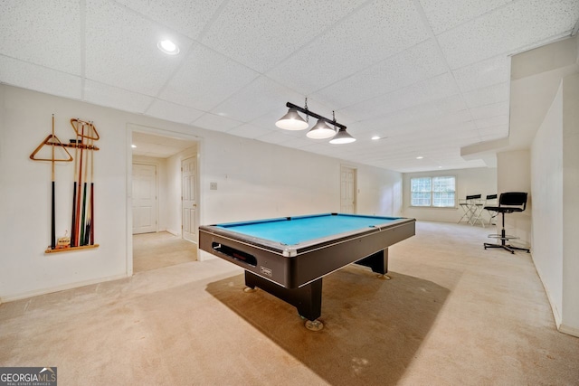 game room featuring light colored carpet, pool table, and a drop ceiling