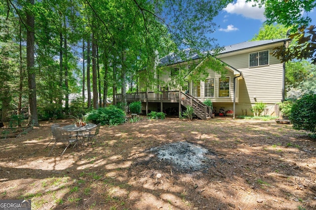 view of yard with a wooden deck