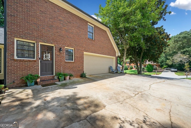 view of property exterior featuring a garage