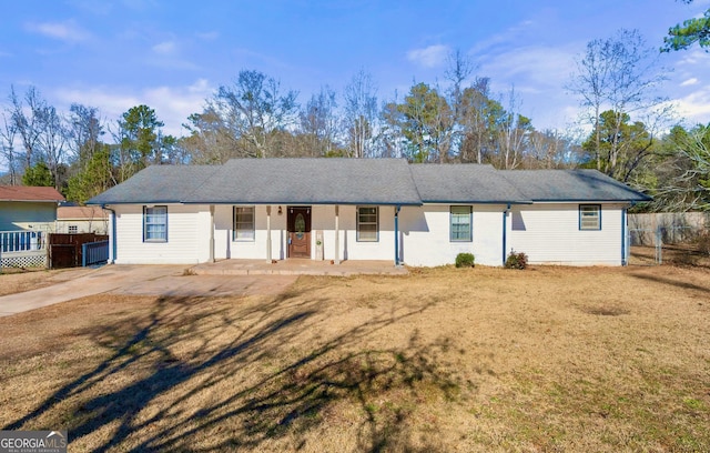 ranch-style house featuring a porch and a front yard