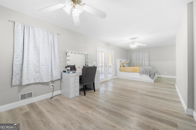 unfurnished bedroom featuring ceiling fan, access to exterior, light wood-type flooring, and french doors