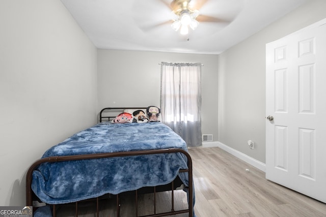 bedroom featuring ceiling fan and light wood-type flooring