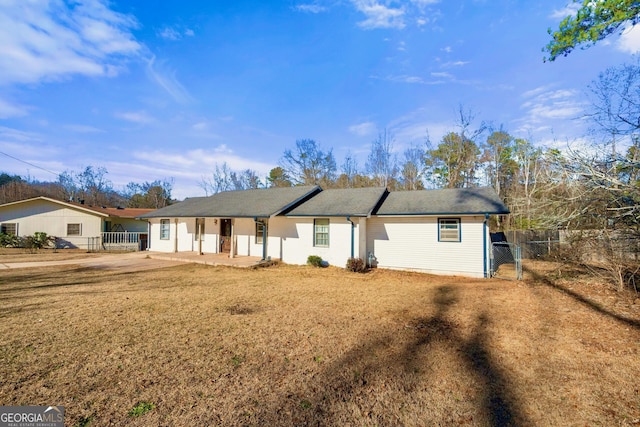 ranch-style house with a front lawn