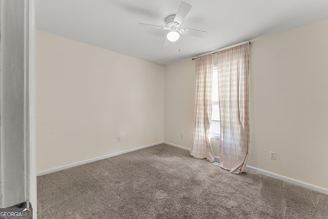 carpeted empty room featuring ceiling fan