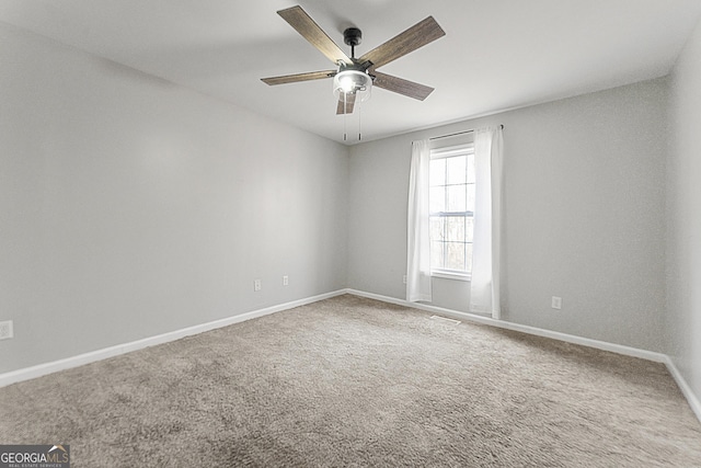 empty room with carpet and ceiling fan