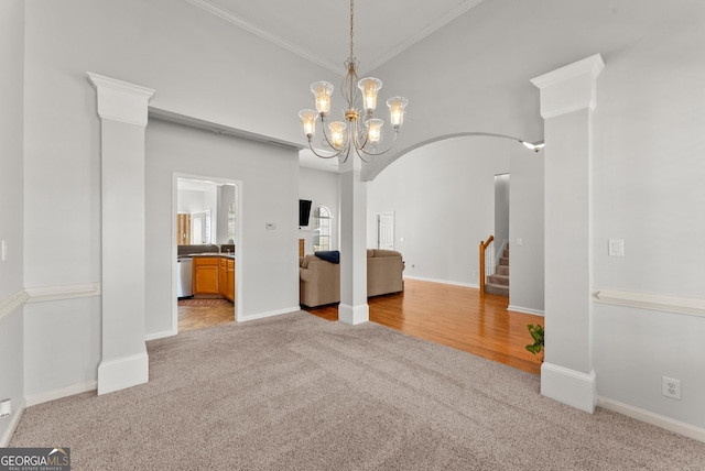 unfurnished dining area featuring light colored carpet, ornamental molding, and a chandelier