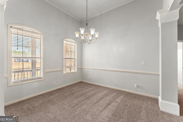 empty room with an inviting chandelier, lofted ceiling, ornamental molding, and carpet