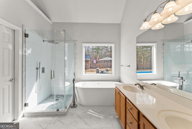 bathroom with vanity, separate shower and tub, and a textured ceiling