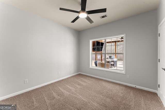 unfurnished room featuring carpet floors and ceiling fan