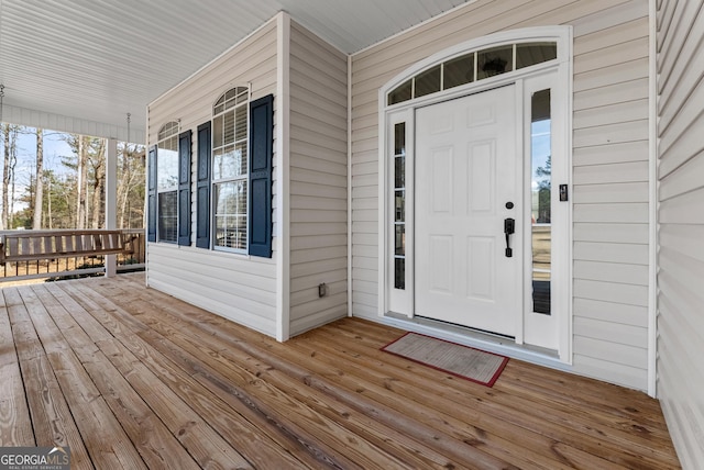 entrance to property featuring a porch