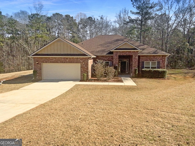 ranch-style home with a garage and a front lawn