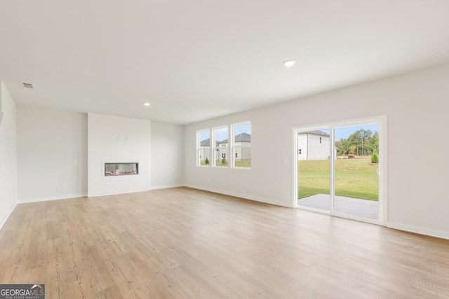 unfurnished living room with light hardwood / wood-style floors