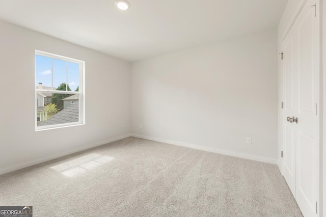 unfurnished bedroom with a closet and carpet