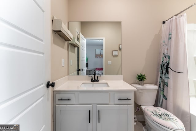 bathroom featuring vanity and toilet