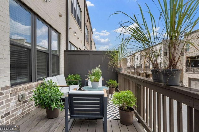 wooden terrace featuring outdoor lounge area