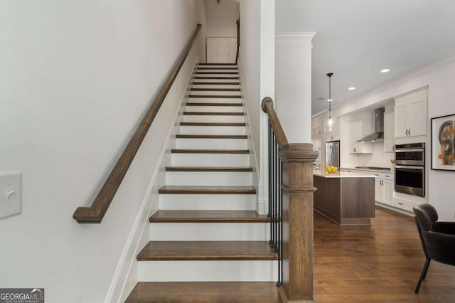 staircase featuring wood-type flooring