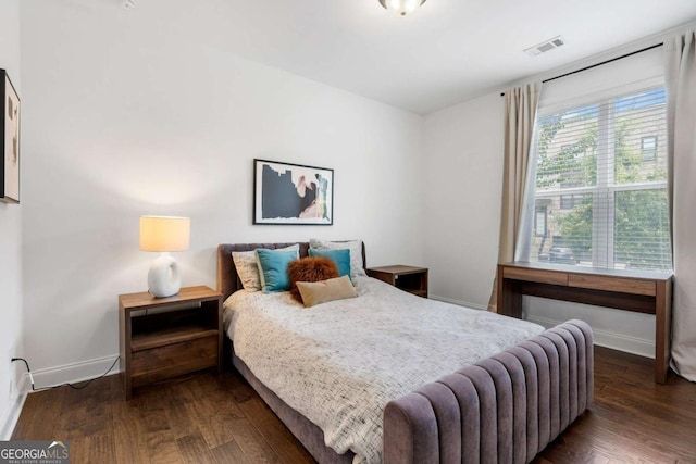 bedroom featuring dark hardwood / wood-style floors