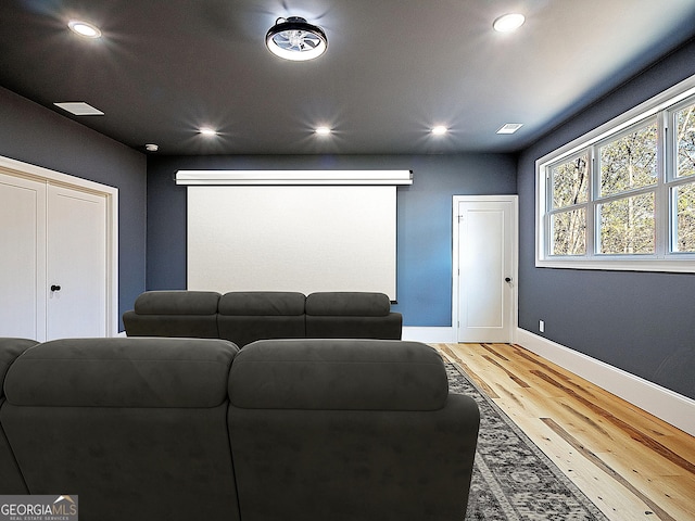 cinema featuring recessed lighting, visible vents, baseboards, and wood finished floors